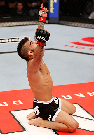 JARAGUA DO SUL, BRAZIL - MAY 18: John Lineker reacts after knocking out Azamat Gashimov in their flyweight bout during the UFC on FX event on May 18, 2013 at Arena Jaragua in Jaragua do Sul, Santa Catarina, Brazil. (Photo by Josh Hedges/Zuffa LLC/Zuffa