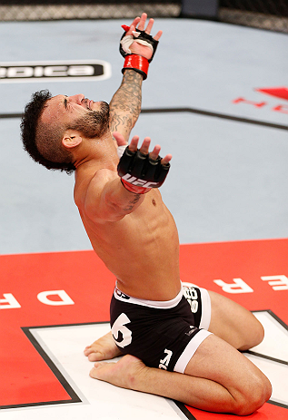 JARAGUA DO SUL, BRAZIL - MAY 18: John Lineker reacts after knocking out Azamat Gashimov in their flyweight bout during the UFC on FX event on May 18, 2013 at Arena Jaragua in Jaragua do Sul, Santa Catarina, Brazil. (Photo by Josh Hedges/Zuffa LLC/Zuffa