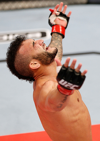 JARAGUA DO SUL, BRAZIL - MAY 18: John Lineker reacts after knocking out Azamat Gashimov in their flyweight bout during the UFC on FX event on May 18, 2013 at Arena Jaragua in Jaragua do Sul, Santa Catarina, Brazil. (Photo by Josh Hedges/Zuffa LLC/Zuffa