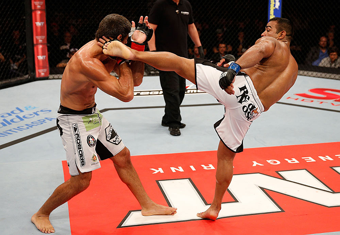 JARAGUA DO SUL, BRAZIL - MAY 18: (R-L) Michel Prazeres kicks Paulo Thiago in their welterweight bout during the UFC on FX event on May 18, 2013 at Arena Jaragua in Jaragua do Sul, Santa Catarina, Brazil. (Photo by Josh Hedges/Zuffa LLC/Zuffa LLC via Getty