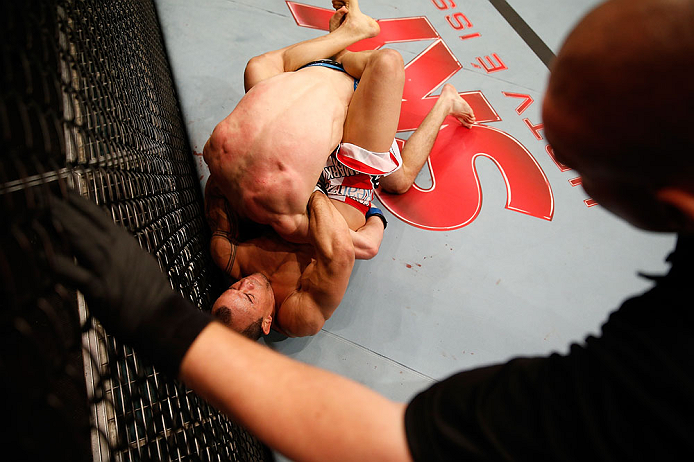 JARAGUA DO SUL, BRAZIL - MAY 18: (L-R) Gleison Tibau secures a guillotine choke submission against John Cholish in their lightweight bout during the UFC on FX event on May 18, 2013 at Arena Jaragua in Jaragua do Sul, Santa Catarina, Brazil. (Photo by Josh