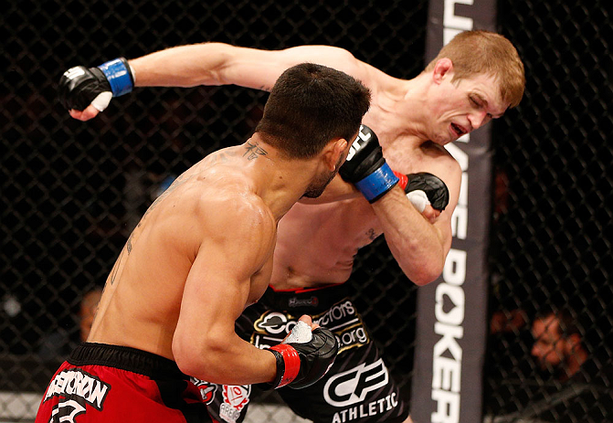 JARAGUA DO SUL, BRAZIL - MAY 18: (L-R) Rafael dos Anjos punches Evan Dunham in their lightweight bout during the UFC on FX event on May 18, 2013 at Arena Jaragua in Jaragua do Sul, Santa Catarina, Brazil. (Photo by Josh Hedges/Zuffa LLC/Zuffa LLC via Gett