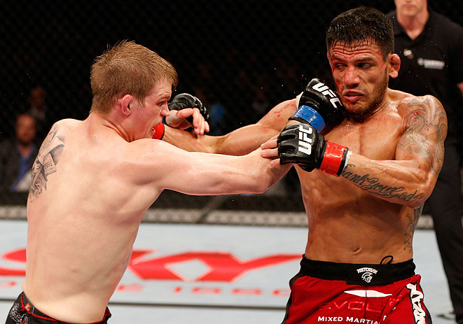 JARAGUA DO SUL, BRAZIL - MAY 18: (L-R) Evan Dunham punches Rafael dos Anjos in their lightweight bout during the UFC on FX event on May 18, 2013 at Arena Jaragua in Jaragua do Sul, Santa Catarina, Brazil. (Photo by Josh Hedges/Zuffa LLC/Zuffa LLC via Gett