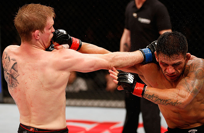 JARAGUA DO SUL, BRAZIL - MAY 18: (L-R) Evan Dunham and Rafael dos Anjos trade punches in their lightweight bout during the UFC on FX event on May 18, 2013 at Arena Jaragua in Jaragua do Sul, Santa Catarina, Brazil. (Photo by Josh Hedges/Zuffa LLC/Zuffa LL