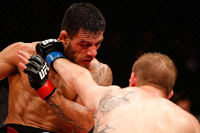 JARAGUA DO SUL, BRAZIL - MAY 18: (R-L) Rafael dos Anjos punches Evan Dunham in their lightweight bout during the UFC on FX event on May 18, 2013 at Arena Jaragua in Jaragua do Sul, Santa Catarina, Brazil. (Photo by Josh Hedges/Zuffa LLC/Zuffa LLC via Gett