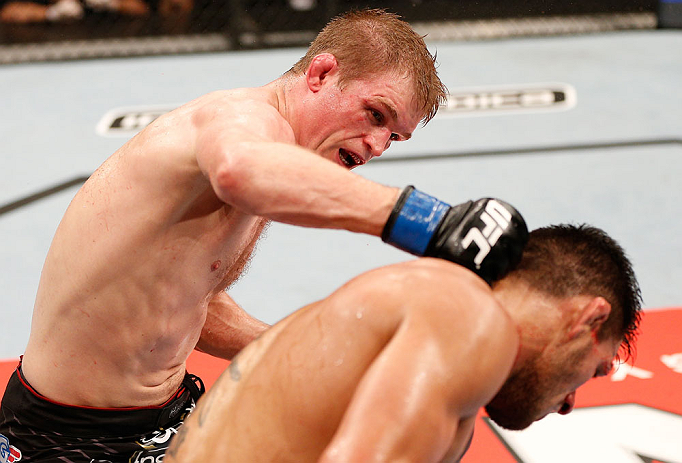 JARAGUA DO SUL, BRAZIL - MAY 18: (L-R) Evan Dunham punches Rafael dos Anjos in their lightweight bout during the UFC on FX event on May 18, 2013 at Arena Jaragua in Jaragua do Sul, Santa Catarina, Brazil. (Photo by Josh Hedges/Zuffa LLC/Zuffa LLC via G