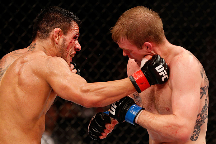 JARAGUA DO SUL, BRAZIL - MAY 18: (L-R) Rafael dos Anjos punches Evan Dunham in their lightweight bout during the UFC on FX event on May 18, 2013 at Arena Jaragua in Jaragua do Sul, Santa Catarina, Brazil. (Photo by Josh Hedges/Zuffa LLC/Zuffa LLC via G