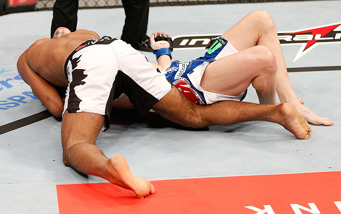 JARAGUA DO SUL, BRAZIL - MAY 18: (L-R) Ronaldo 'Jacare' Souza secures an arm triangle choke submission against Chris Camozzi in their middleweight bout during the UFC on FX event on May 18, 2013 at Arena Jaragua in Jaragua do Sul, Santa Catarina, Brazil