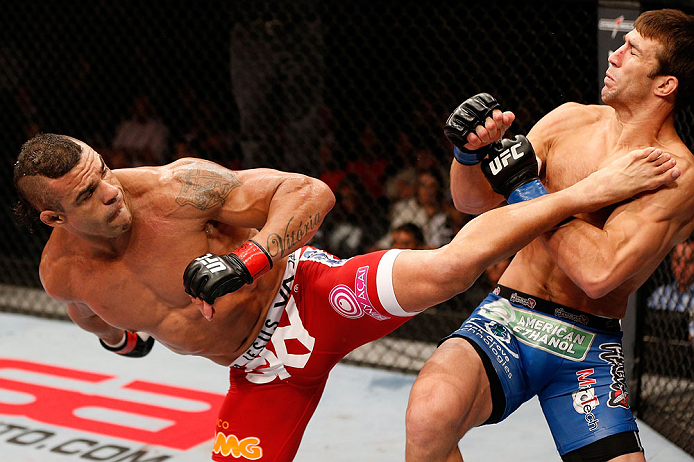 JARAGUA DO SUL, BRAZIL - MAY 18: (L-R) Vitor Belfort knocks out Luke Rockhold with a spinning heel kick in their middleweight bout during the UFC on FX event on May 18, 2013 at Arena Jaragua in Jaragua do Sul, Santa Catarina, Brazil. (Photo by Josh Hedges