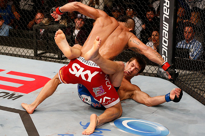 JARAGUA DO SUL, BRAZIL - MAY 18: (L-R) Vitor Belfort finishes Luke Rockhold with punches after knocking him down with a spinning heel kick in their middleweight bout during the UFC on FX event on May 18, 2013 at Arena Jaragua in Jaragua do Sul, Santa Cata