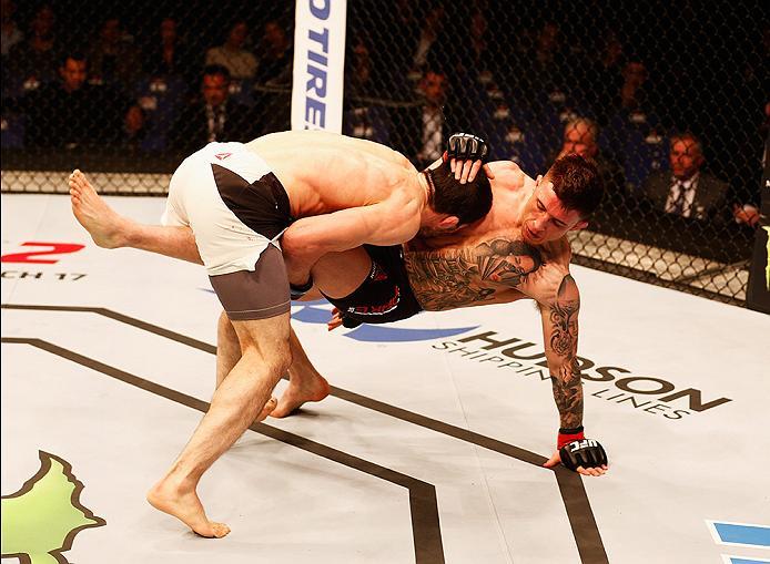 LONDON, ENGLAND - FEBRUARY 27: Norman 'Stormin' Parke of Northern Ireland (R) is taken down to the floor by Rustam 'Tiger' Khabilov of Russia compete in their Lightweight bout during the UFC Fight Night held at at Indigo at The O2 Arena on February 27, 2