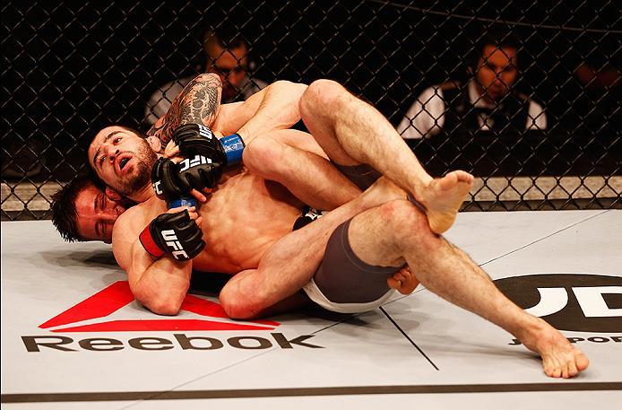 LONDON, ENGLAND - FEBRUARY 27: Norman 'Stormin' Parke of Northern Ireland gets a choke hold on Rustam 'Tiger' Khabilov of Russia compete in their Lightweight bout during the UFC Fight Night held at at Indigo at The O2 Arena on February 27, 2016 in London