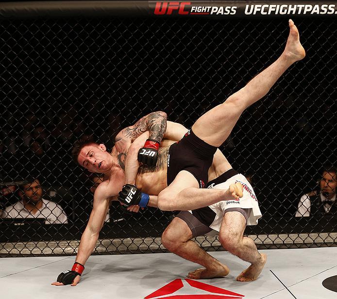 LONDON, ENGLAND - FEBRUARY 27: Norman 'Stormin' Parke of Northern Ireland is taken down to the floor by Rustam 'Tiger' Khabilov of Russia compete in their Lightweight bout during the UFC Fight Night held at at Indigo at The O2 Arena on February 27, 2016