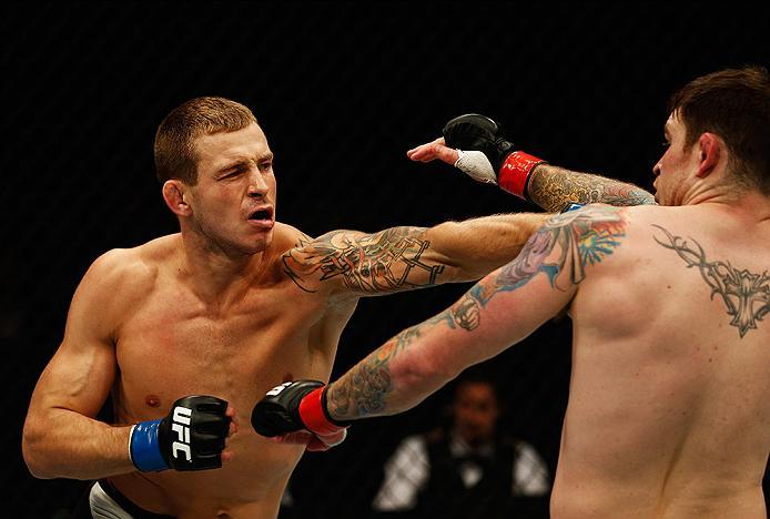 LONDON, ENGLAND - FEBRUARY 27: Brad 'Bear' Scott of England (L) tries to defend against the attack from Krzysztof Jotko of Poland (R) in their Middleweight bout during the UFC Fight Night held at at Indigo at The O2 Arena on February 27, 2016 in London,