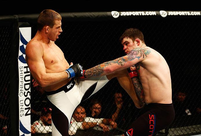LONDON, ENGLAND - FEBRUARY 27: Brad 'Bear' Scott of England (R) looks to hold off the attack from Krzysztof Jotko of Poland in their Middleweight bout during the UFC Fight Night held at at Indigo at The O2 Arena on February 27, 2016 in London, England.