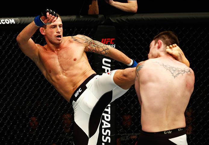 LONDON, ENGLAND - FEBRUARY 27: Brad 'Bear' Scott of England (R) looks to hold off the attack from Krzysztof Jotko of Poland in their Middleweight bout during the UFC Fight Night held at at Indigo at The O2 Arena on February 27, 2016 in London, England.