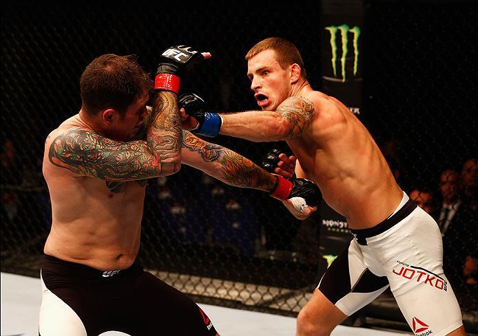 LONDON, ENGLAND - FEBRUARY 27: Brad 'Bear' Scott of England (L) tries to hold off the attack from Krzysztof Jotko of Poland compete in their Middleweight bout during the UFC Fight Night held at at Indigo at The O2 Arena on February 27, 2016 in London, En