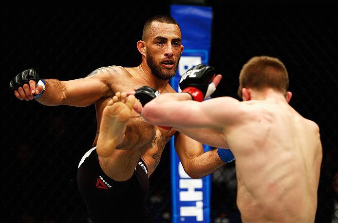 LONDON, ENGLAND - FEBRUARY 27: Yaotzin Meza of the USA (L) looks to land a high kick on Arnold 'Almighty' Allen of England during their Featherweight bout during the UFC Fight Night held at at Indigo at The O2 Arena on February 27, 2016 in London, England