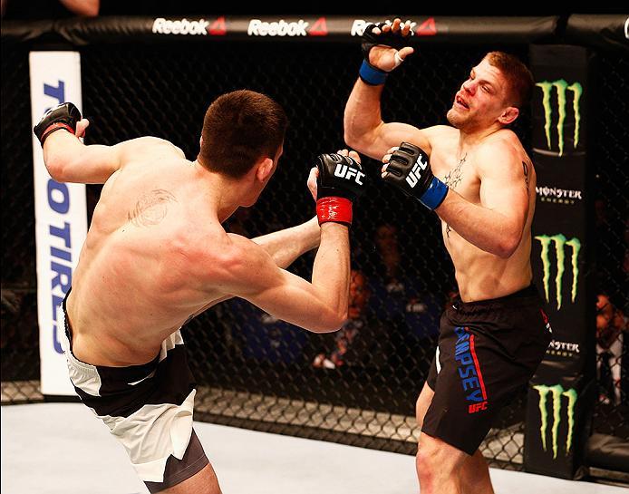 LONDON, ENGLAND - FEBRUARY 27: Scott Askham of England (L) KO's Chris Dempsey of the USA with a high kick in their Middleweight bout during the UFC Fight Night held at at Indigo at The O2 Arena on February 27, 2016 in London, England. (Photo by Dean Mou