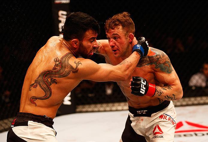 LONDON, ENGLAND - FEBRUARY 27: Mike 'The Warrior' Wilkinson of England (R) and Makwan 'Mr. Finland' Amirkhani of Kurdistan (L) compete in their Featherweight bout during the UFC Fight Night held at at Indigo at The O2 Arena on February 27, 2016 in London