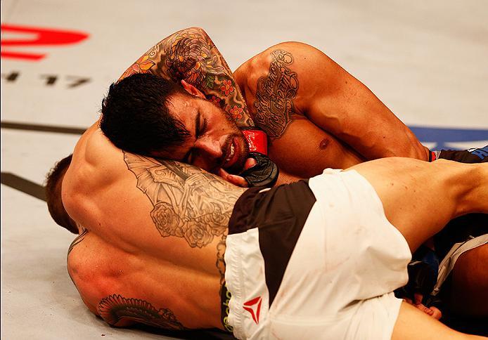 LONDON, ENGLAND - FEBRUARY 27: Mike 'The Warrior' Wilkinson of England (L) and Makwan 'Mr. Finland' Amirkhani of Kurdistan (R) compete in their Featherweight bout during the UFC Fight Night held at at Indigo at The O2 Arena on February 27, 2016 in London