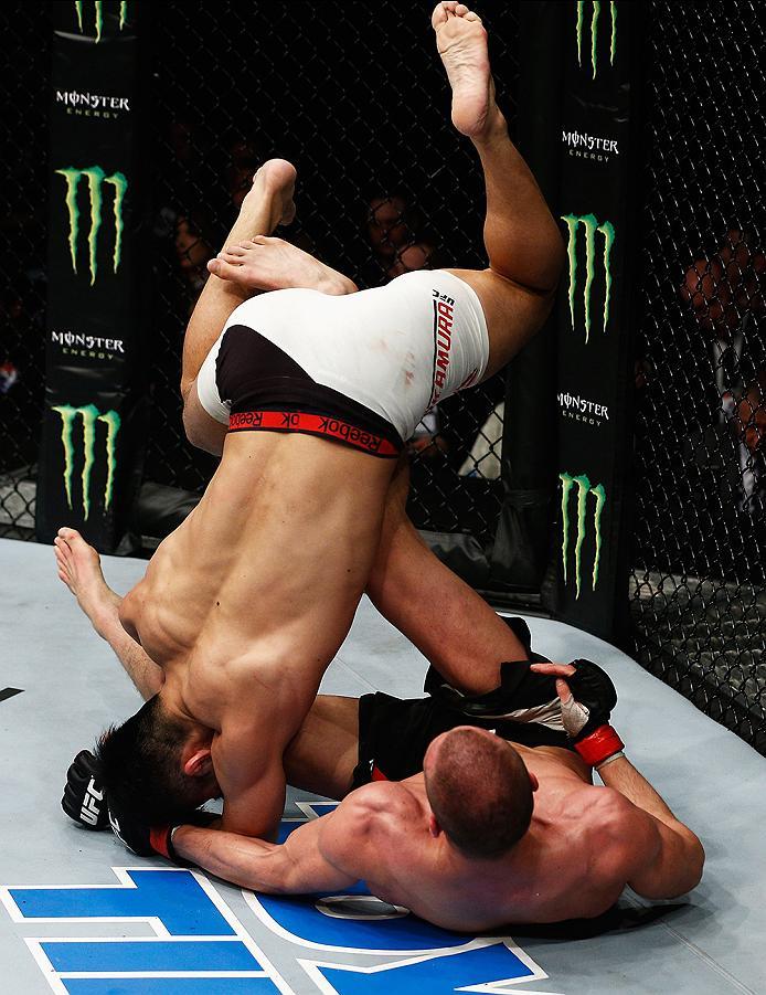 LONDON, ENGLAND - FEBRUARY 27: Tom Breese of England (R) and Keita 'K-Taro' Nakamura of Japan (L) compete in their Welterweight bout during the UFC Fight Night held at at Indigo at The O2 Arena on February 27, 2016 in London, England. (Photo by Dean Mou