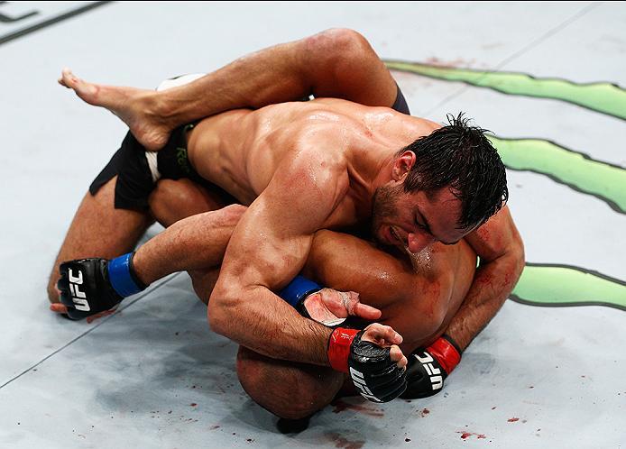 LONDON, ENGLAND - FEBRUARY 27: Thales Leites of Brazil is pinned to the floor by Gegard Mousasi of Holland in their Middleweight bout during the UFC Fight Night held at at Indigo at The O2 Arena on February 27, 2016 in London, England. (Photo by Dean Mo