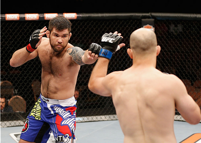 LAS VEGAS, NV - JULY 06: (L-R) Robert Drysdale punches Keith Berish in their light heavyweight fight during the TUF 19 Finale inside the Mandalay Bay Events Center on July 6, 2014 in Las Vegas, Nevada. (Photo by Josh Hedges/Zuffa LLC/Zuffa LLC via Getty