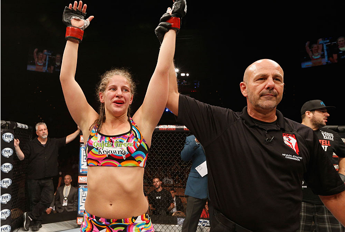 LAS VEGAS, NV - JULY 06: Sarah Moras celebrates after defeating Alexis Dufresne in their women's bantamweight fight during the Ultimate Fighter Finale inside the Mandalay Bay Events Center on July 6, 2014 in Las Vegas, Nevada. (Photo by Josh Hedges/Zuff