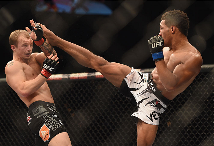 LAS VEGAS, NV - JULY 06: (R-L) Kevin Lee kicks Jesse Ronson in their flyweight fight during the Ultimate Fighter Finale inside the Mandalay Bay Events Center on July 6, 2014 in Las Vegas, Nevada. (Photo by Jeff Bottari/Zuffa LLC/Zuffa LLC via Getty Imag