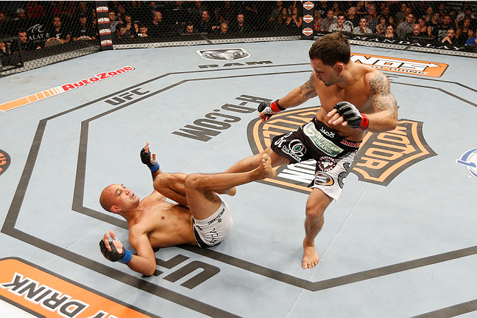 LAS VEGAS, NV - JULY 06: (R-L) Frankie Edgar kicks BJ Penn in their featherweight fight during the Ultimate Fighter Finale inside the Mandalay Bay Events Center on July 6, 2014 in Las Vegas, Nevada. (Photo by Josh Hedges/Zuffa LLC/Zuffa LLC via Getty Im