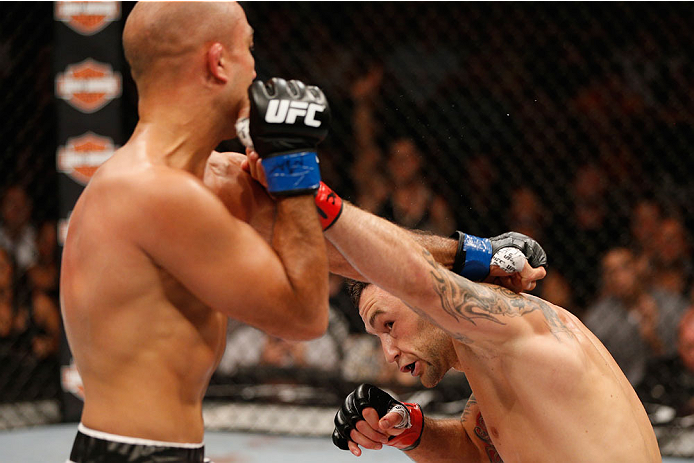LAS VEGAS, NV - JULY 06: (R-L) Frankie Edgar and BJ Penn exchange punches in their featherweight fight during the Ultimate Fighter Finale inside the Mandalay Bay Events Center on July 6, 2014 in Las Vegas, Nevada. (Photo by Josh Hedges/Zuffa LLC/Zuffa L