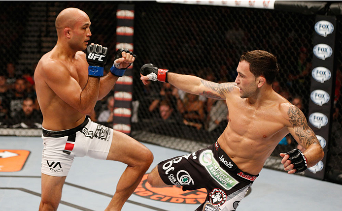 LAS VEGAS, NV - JULY 06: (R-L) Frankie Edgar kicks BJ Penn in their featherweight fight during the Ultimate Fighter Finale inside the Mandalay Bay Events Center on July 6, 2014 in Las Vegas, Nevada. (Photo by Josh Hedges/Zuffa LLC/Zuffa LLC via Getty Im