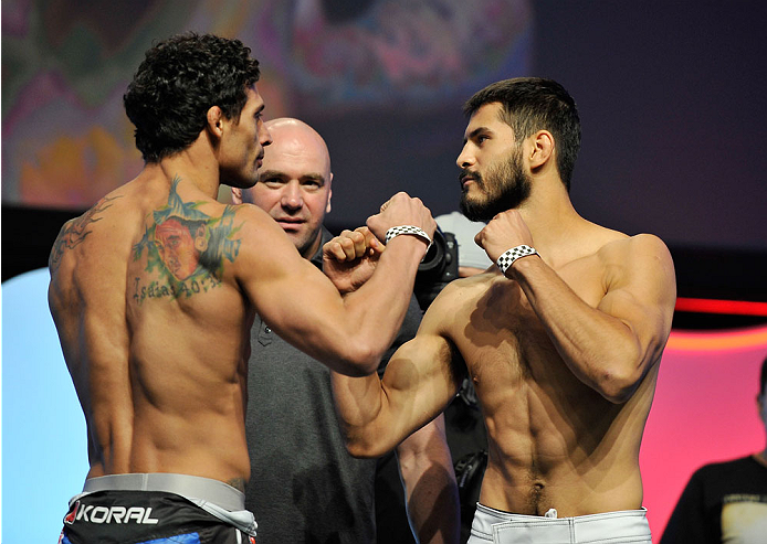 LAS VEGAS, NV - JULY 05: Mixed martial artists Adriano Martins (L) and Juan Manuel Puig face off during the TUF 19 Finale weigh-in at the Mandalay Bay Convention Center on July 5, 2014 in Las Vegas, Nevada. (Photo by David Becker/Zuffa LLC/Zuffa LLC via G