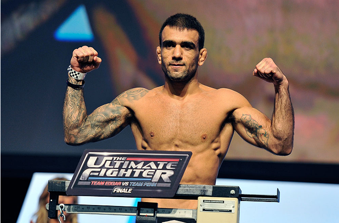 LAS VEGAS, NV - JULY 05: Mixed martial artist Leandro Issa poses on the scale during the TUF 19 Finale weigh-in at the Mandalay Bay Convention Center on July 5, 2014 in Las Vegas, Nevada. (Photo by David Becker/Zuffa LLC/Zuffa LLC via Getty Images)