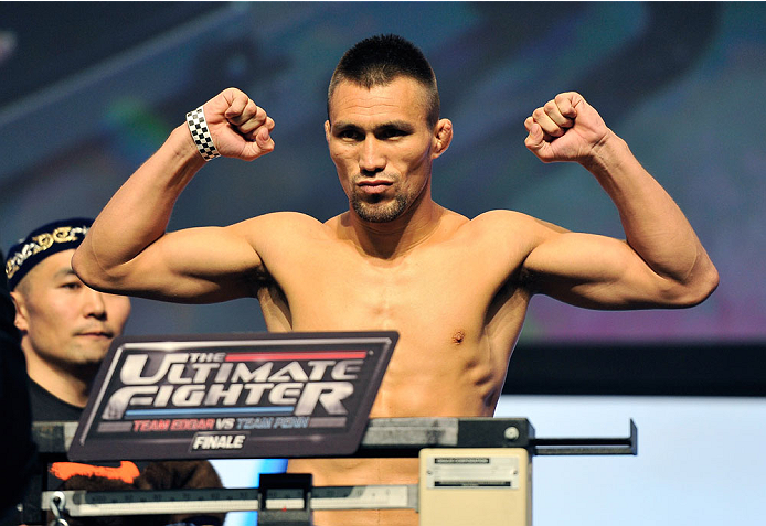 LAS VEGAS, NV - JULY 05: Mixed martial artist Jumabieke Tuerxun poses on the scale during the TUF 19 Finale weigh-in at the Mandalay Bay Convention Center on July 5, 2014 in Las Vegas, Nevada. (Photo by David Becker/Zuffa LLC/Zuffa LLC via Getty Images)