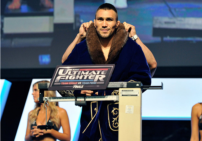LAS VEGAS, NV - JULY 05: Mixed martial artist Jumabieke Tuerxun poses on the scale during the TUF 19 Finale weigh-in at the Mandalay Bay Convention Center on July 5, 2014 in Las Vegas, Nevada. (Photo by David Becker/Zuffa LLC/Zuffa LLC via Getty Images)