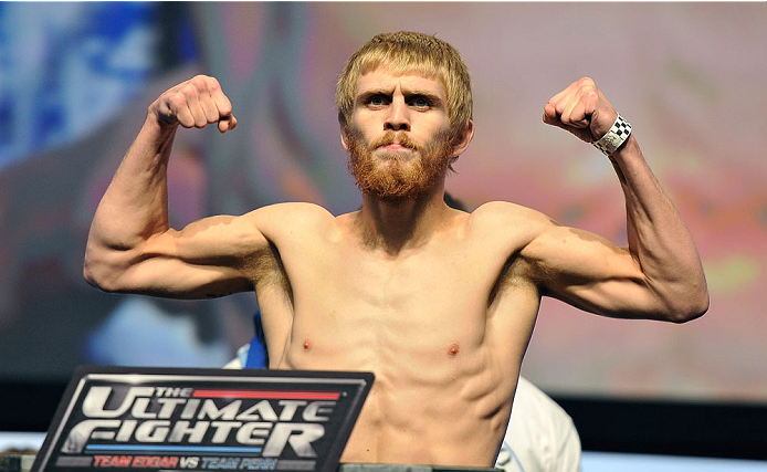 LAS VEGAS, NV - JULY 05: Mixed martial artist Justin Scoggins poses on the scale during the TUF 19 Finale weigh-in at the Mandalay Bay Convention Center on July 5, 2014 in Las Vegas, Nevada. (Photo by David Becker/Zuffa LLC/Zuffa LLC via Getty Images)