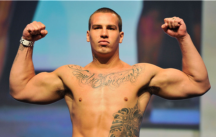 LAS VEGAS, NV - JULY 05: Mixed martial artist Guto Inocente poses on the scale during the TUF 19 Finale weigh-in at the Mandalay Bay Convention Center on July 5, 2014 in Las Vegas, Nevada. (Photo by David Becker/Zuffa LLC/Zuffa LLC via Getty Images)