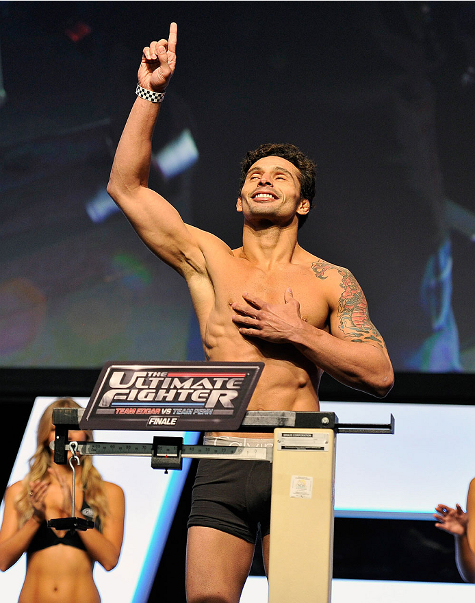 LAS VEGAS, NV - JULY 05: Mixed martial artist Adriano Martins poses on the scale during the TUF 19 Finale weigh-in at the Mandalay Bay Convention Center on July 5, 2014 in Las Vegas, Nevada. (Photo by David Becker/Zuffa LLC/Zuffa LLC via Getty Images)