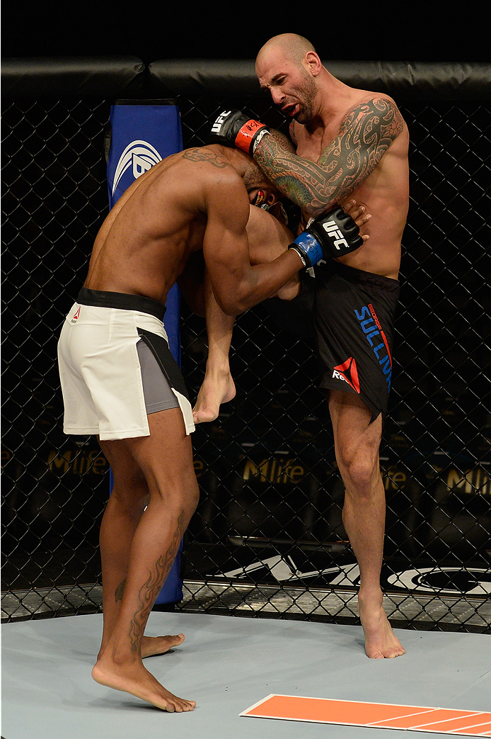 LAS VEGAS, NV - JULY 12: (R-L) George Sullivan knees Dominic Waters in their welterweight bout during the Ultimate Fighter Finale inside MGM Grand Garden Arena on July 12, 2015 in Las Vegas, Nevada. (Photo by Brandon Magnus/Zuffa LLC/Zuffa LLC via Getty