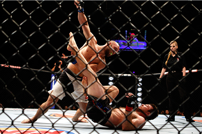 LAS VEGAS, NV - JULY 12: Trevor Smith (top) punches Dan Miller in their middleweight bout during the Ultimate Fighter Finale inside MGM Grand Garden Arena on July 12, 2015 in Las Vegas, Nevada. (Photo by Mitch Viquez/Zuffa LLC/Zuffa LLC via Getty Images