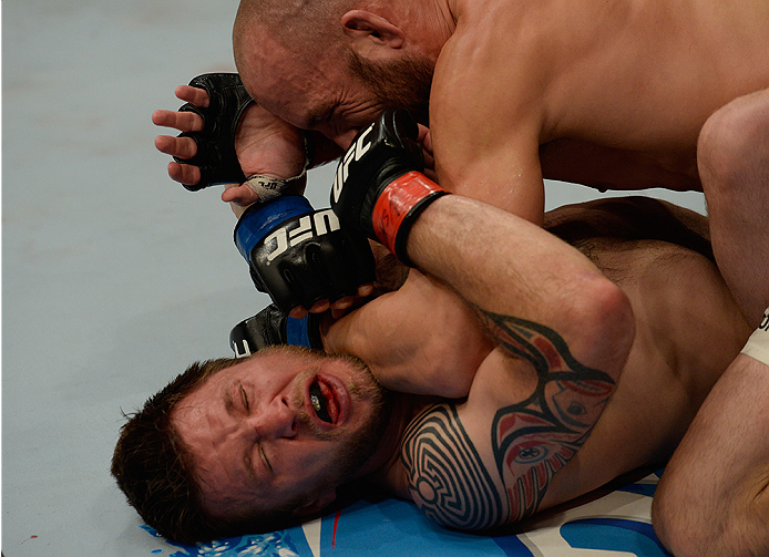 LAS VEGAS, NV - JULY 12: Trevor Smith (top) elbows Dan Miller in their middleweight bout during the Ultimate Fighter Finale inside MGM Grand Garden Arena on July 12, 2015 in Las Vegas, Nevada. (Photo by Brandon Magnus/Zuffa LLC/Zuffa LLC via Getty Image