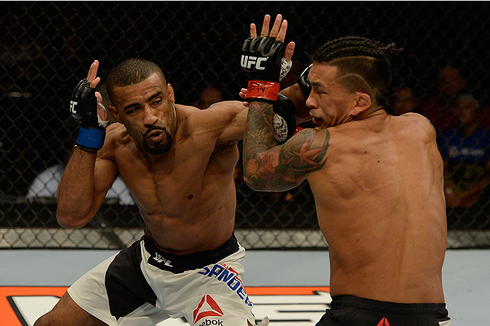 LAS VEGAS, NV - JULY 12: (L-R) Jerrod Sanders punches Russell Doane in their bantamweight bout during the Ultimate Fighter Finale inside MGM Grand Garden Arena on July 12, 2015 in Las Vegas, Nevada. (Photo by Brandon Magnus/Zuffa LLC/Zuffa LLC via Getty