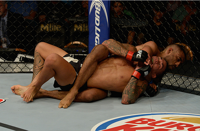 LAS VEGAS, NV - JULY 12: Jerrod Sanders (right) attempts to submit Russell Doane in their bantamweight bout during the Ultimate Fighter Finale inside MGM Grand Garden Arena on July 12, 2015 in Las Vegas, Nevada. (Photo by Brandon Magnus/Zuffa LLC/Zuffa