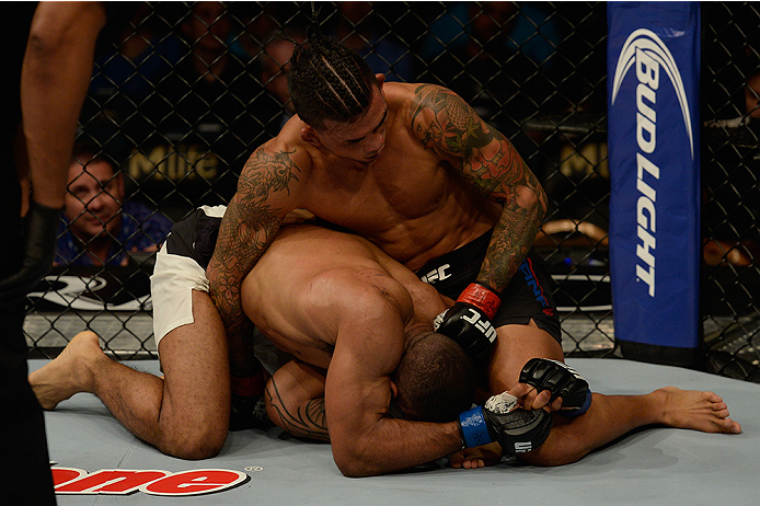 LAS VEGAS, NV - JULY 12: Russell Doane (top) punches Jerrod Sanders in their bantamweight bout during the Ultimate Fighter Finale inside MGM Grand Garden Arena on July 12, 2015 in Las Vegas, Nevada. (Photo by Brandon Magnus/Zuffa LLC/Zuffa LLC via Getty