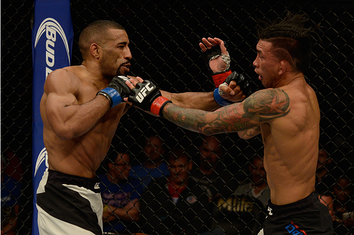 LAS VEGAS, NV - JULY 12: (L-R) Jerrod Sanders punches Russell Doane in their bantamweight bout during the Ultimate Fighter Finale inside MGM Grand Garden Arena on July 12, 2015 in Las Vegas, Nevada. (Photo by Brandon Magnus/Zuffa LLC/Zuffa LLC via Getty