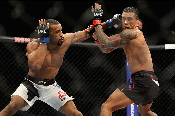 LAS VEGAS, NV - JULY 12: (L-R) Jerrod Sanders punches Russell Doane in their bantamweight bout during the Ultimate Fighter Finale inside MGM Grand Garden Arena on July 12, 2015 in Las Vegas, Nevada. (Photo by Mitch Viquez/Zuffa LLC/Zuffa LLC via Getty I