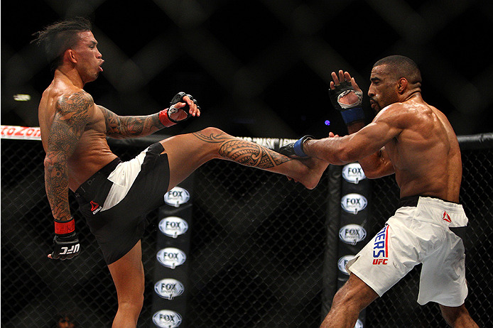 LAS VEGAS, NV - JULY 12: (L-R) Russell Doane kicks Jerrod Sanders in their bantamweight bout during the Ultimate Fighter Finale inside MGM Grand Garden Arena on July 12, 2015 in Las Vegas, Nevada. (Photo by Mitch Viquez/Zuffa LLC/Zuffa LLC via Getty Ima