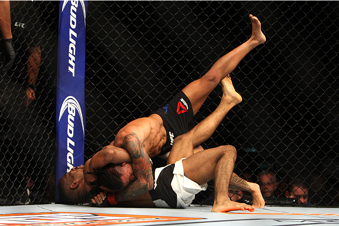 LAS VEGAS, NV - JULY 12: (Bottom) Jerrod Sanders attempts to submit Russell Doane in their bantamweight bout during the Ultimate Fighter Finale inside MGM Grand Garden Arena on July 12, 2015 in Las Vegas, Nevada. (Photo by Mitch Viquez/Zuffa LLC/Zuffa L